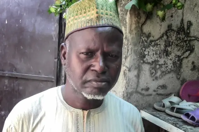 Mohammed, the father of the killed Nigerian aid worker Hauwa Liman poses in Maiduguri on October 16, 2018