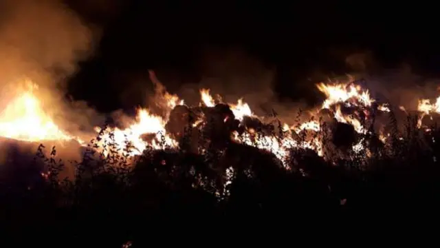 Hay bales on fire