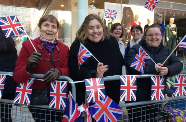 Members of the public prepare for The Queen's visit to Bracknell