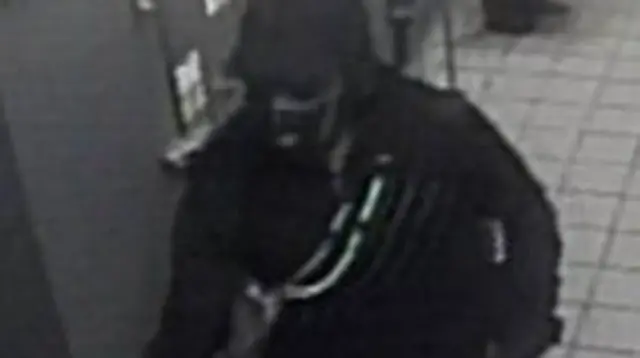 CCTV image of man in mask