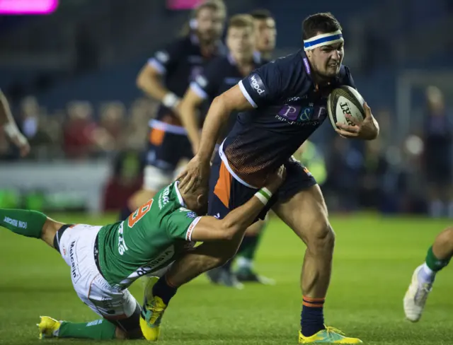 Stuart McInally runs with the ball for Edinburgh