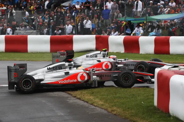 McLaren's Jenson Button and Lewis Hamilton collide