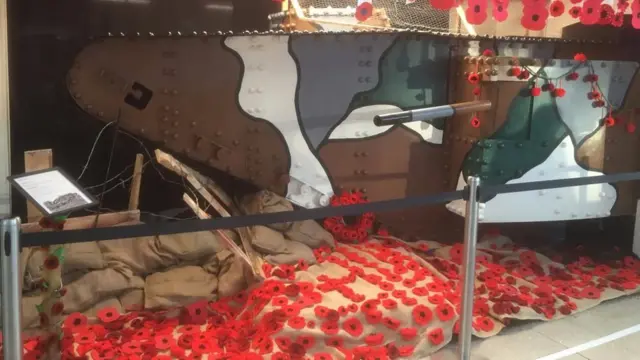 Poppies and a tank