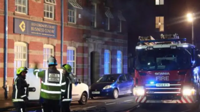 Firefighters at the former court