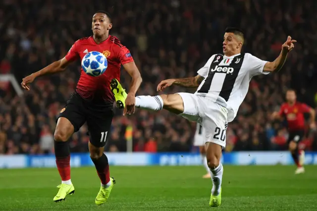 Anthony Martial is challenged by Joao Cancelo