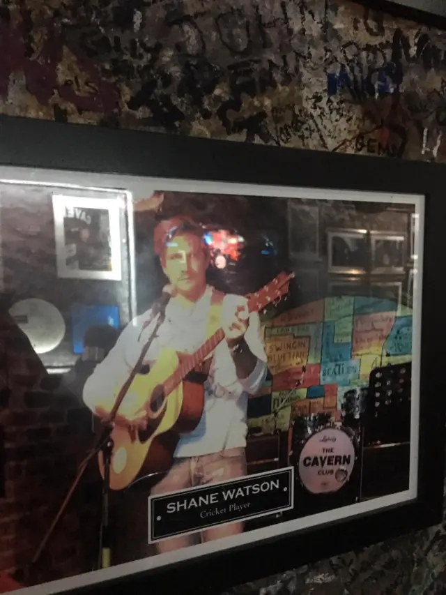 A photo of former Australia cricketer playing guitar at the Cavern Club in Liverpool