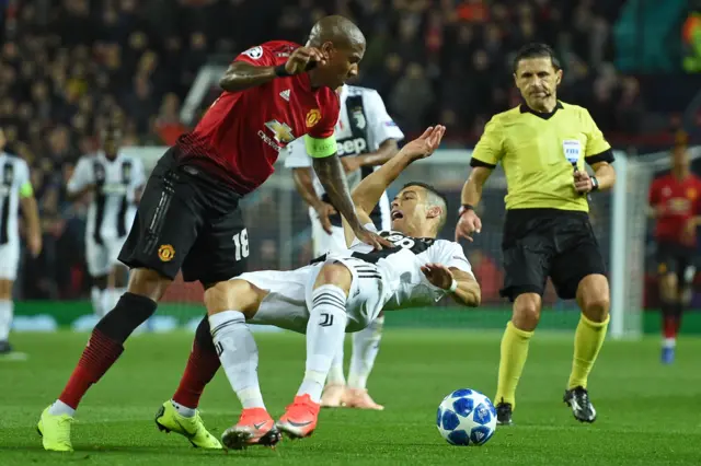 Ashley Young barges Cristiano Ronaldo