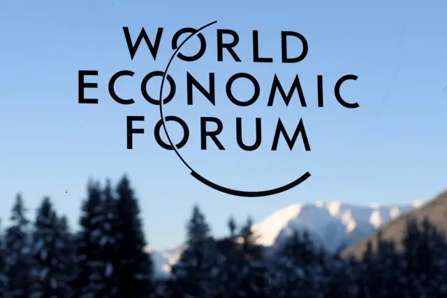 A sign and logo of the World Economic Forum is seen on the third day of the Forum's annual meeting, on January 19, 2017 in Davos