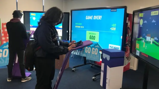 Students try out new computer game on large screens