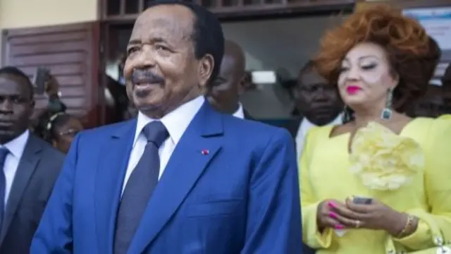 Paul Biya and his wife Chantal Biya (R)