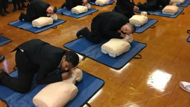 Children learning CPR