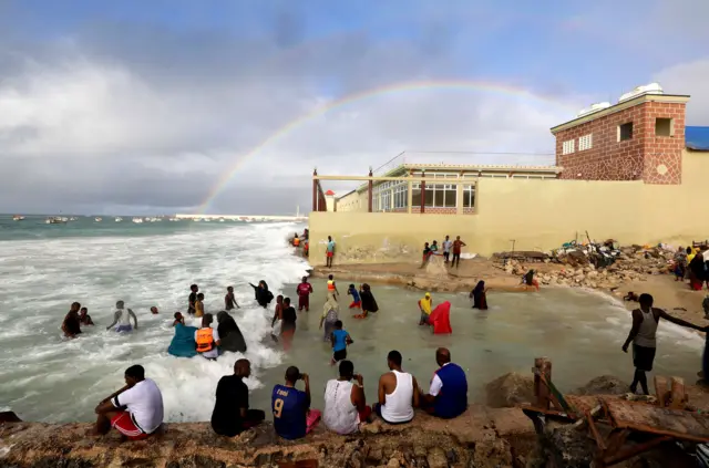 People play near crashing waves at the Liido beach in Mogadishu, Somalia September 14, 2018.