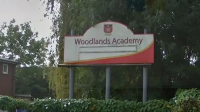 Woodlands Academy sign