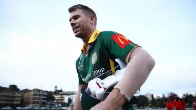 Australia batsman David Warner walks from the field