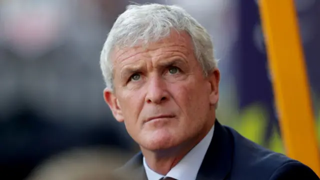 Mark Hughes looks on