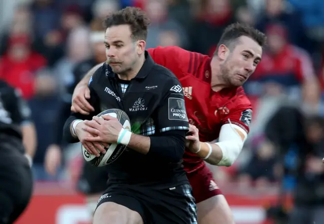 Glasgow Warriors' Ruaridh Jackson is tackled by JJ Hanrahan of Munster