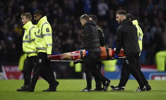 Andy Considine is taken off on a stretcher