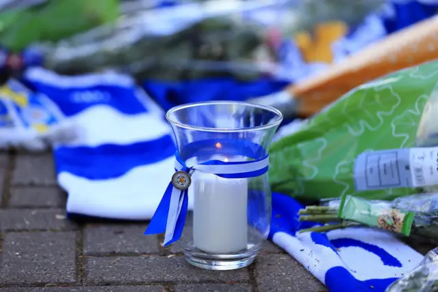 A candle at Leicester's memorial