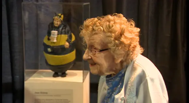 Jean Bishop stood beside the statue of herself