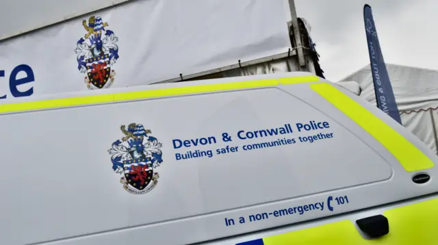 Police car and sign