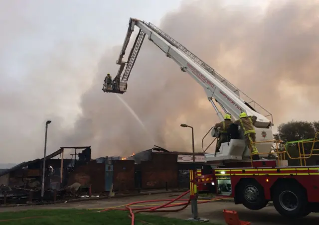 Firefighters using an elevated platform to battle a fire in Hull