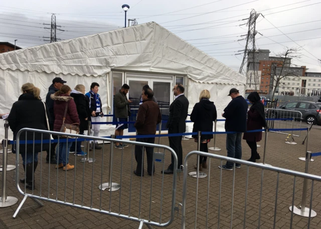 Early arrivals at the marquee