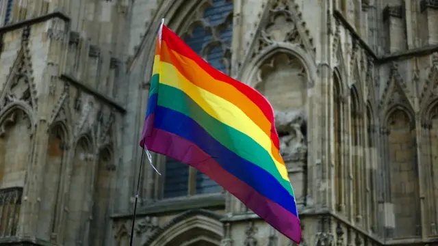 A rainbow flag outside York Minster