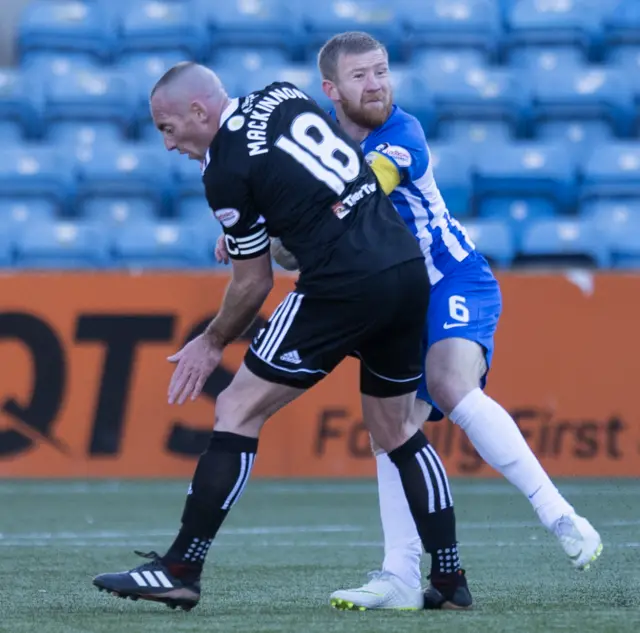 Hamilton's Darian MacKinnon tackles Kilmarnock's Alan Power