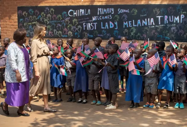 US First Lady Melania Trump (2nd L) visits Chipala Primary School alongside head teacher Maureen Masi (L) on October 4, 2018 during a 1-day visit in Malawi