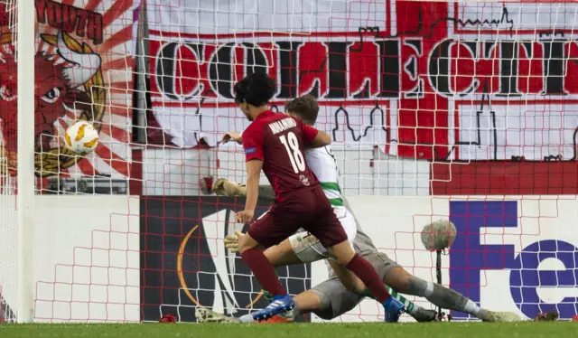 Takumi Minamino prods the ball home from close range