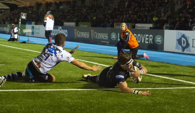 George Turner scores a try for Glasgow