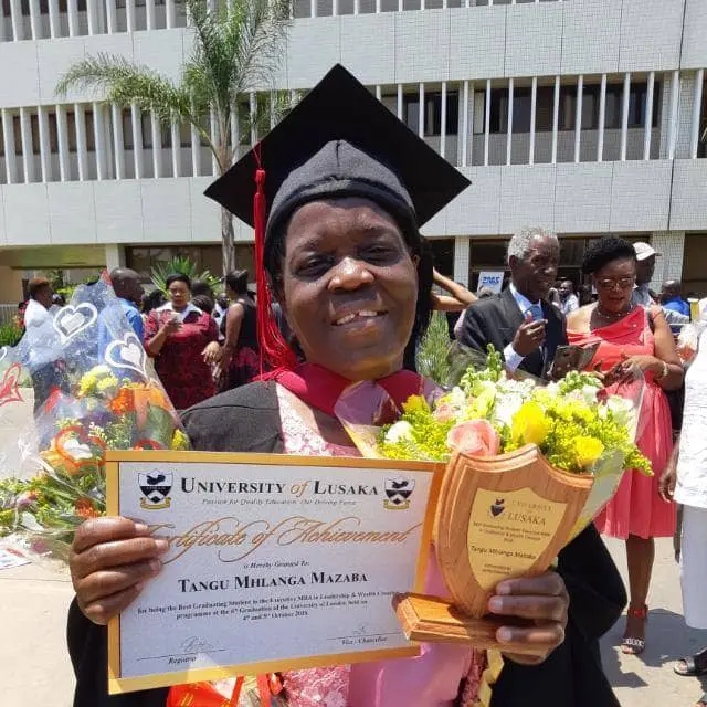 Woman with graduation certificate