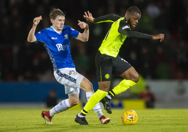 St Johnstone's Blair Alston (left) challenges Celtic's Olivier Ntcham