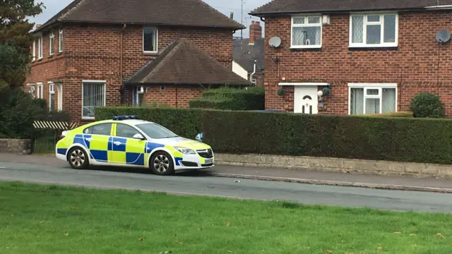 Police car outside house