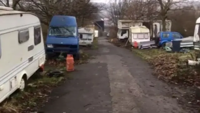 Caravans and vans on the site