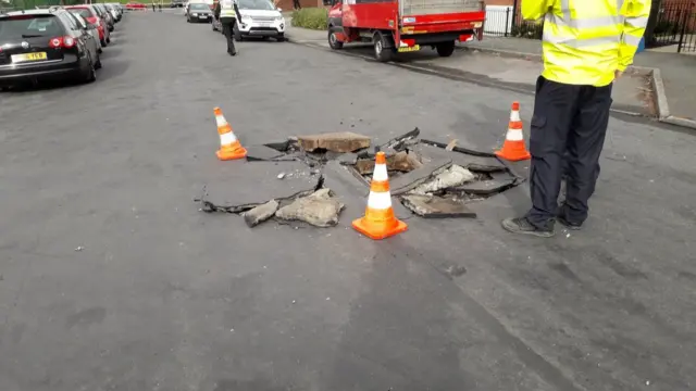 The manhole covers blown off