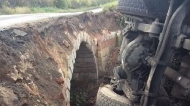 Bridge with lorry on its side