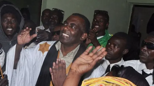 Mauritania anti-slavery activist Biram Ould Dah Ould Abeid (C) is welcomed by supporters as he walks out of jail after the country's supreme court downgraded the crimes they were convicted of last year and ordered their release, on May 17, 2016 in Nouakchott