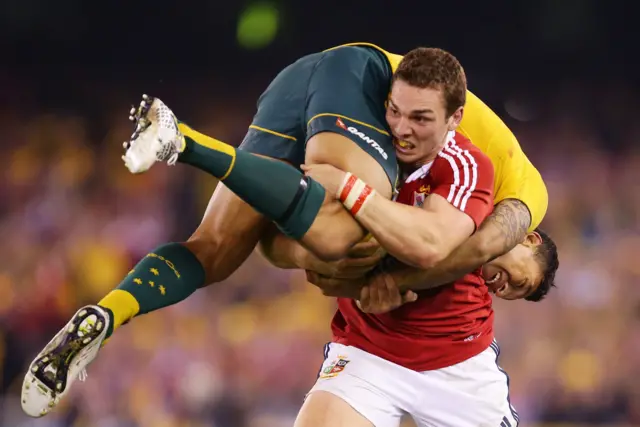 George North carrying Israel Folau