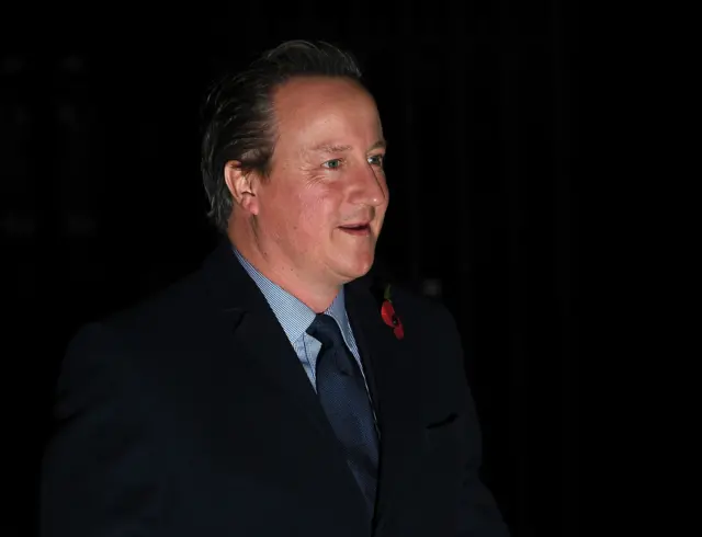 Her predecessor, David Cameron, is also pictured arriving for the service