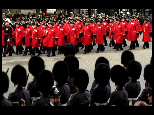 Chelsea Pensioners join the march down Horse Guards Parade