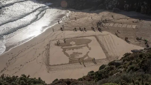 Lieutenant Richard Charles Graves-Sawle's portrait was drawn onto the sand at Porthcurno beach in Cornwall