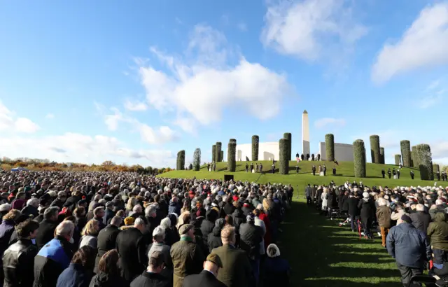 People attend a ceremony at the National Memorial Arboretum, Alrewas, Staffordshire, on the 100th anniversary of the signing of the Armistice which marked the end of the First World War