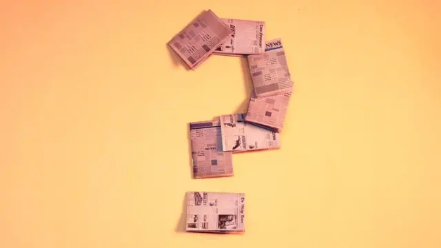 Question mark made out of newspaper