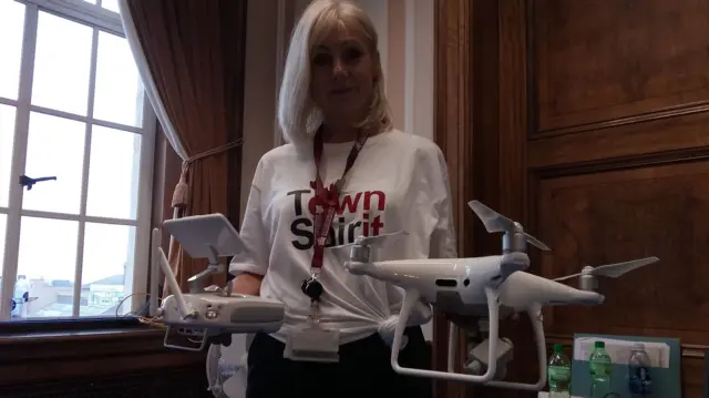 A woman with a drone