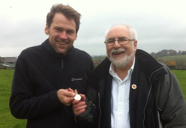 Justin Critchlow and Carlisle bus driver Michael Furmston with the medal