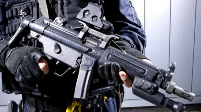 West Midlands Police officer with gun