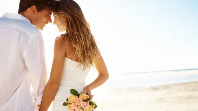 A couple getting married on the beach