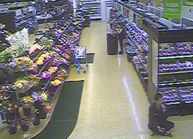 Colin Clarkson sitting on the floor in ASDA