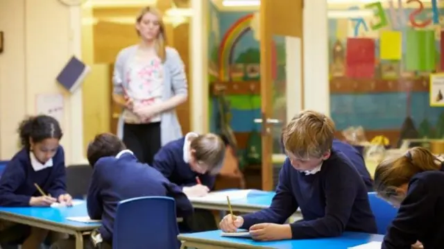 teacher and kids in classroom